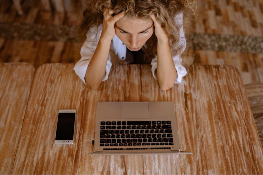 How to Remove a Link from Google-women stressed and looking at her laptop screen