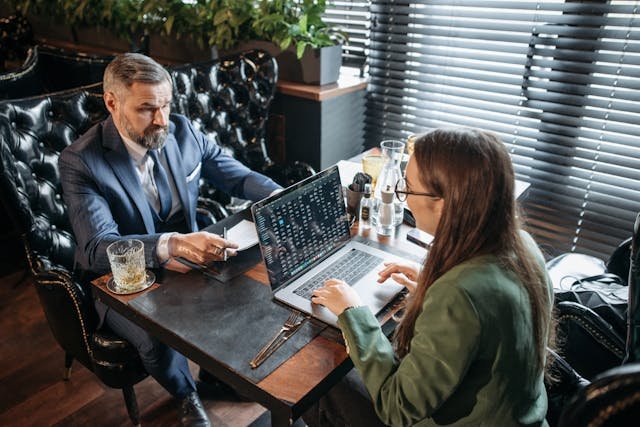A Man and a Woman Talking about Business