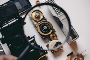 Intricate gears of a camera mechanism magnified, showcasing mechanical precision