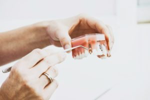 Dentist examining 3D teeth