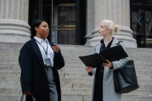 two female lawyers standing outside court